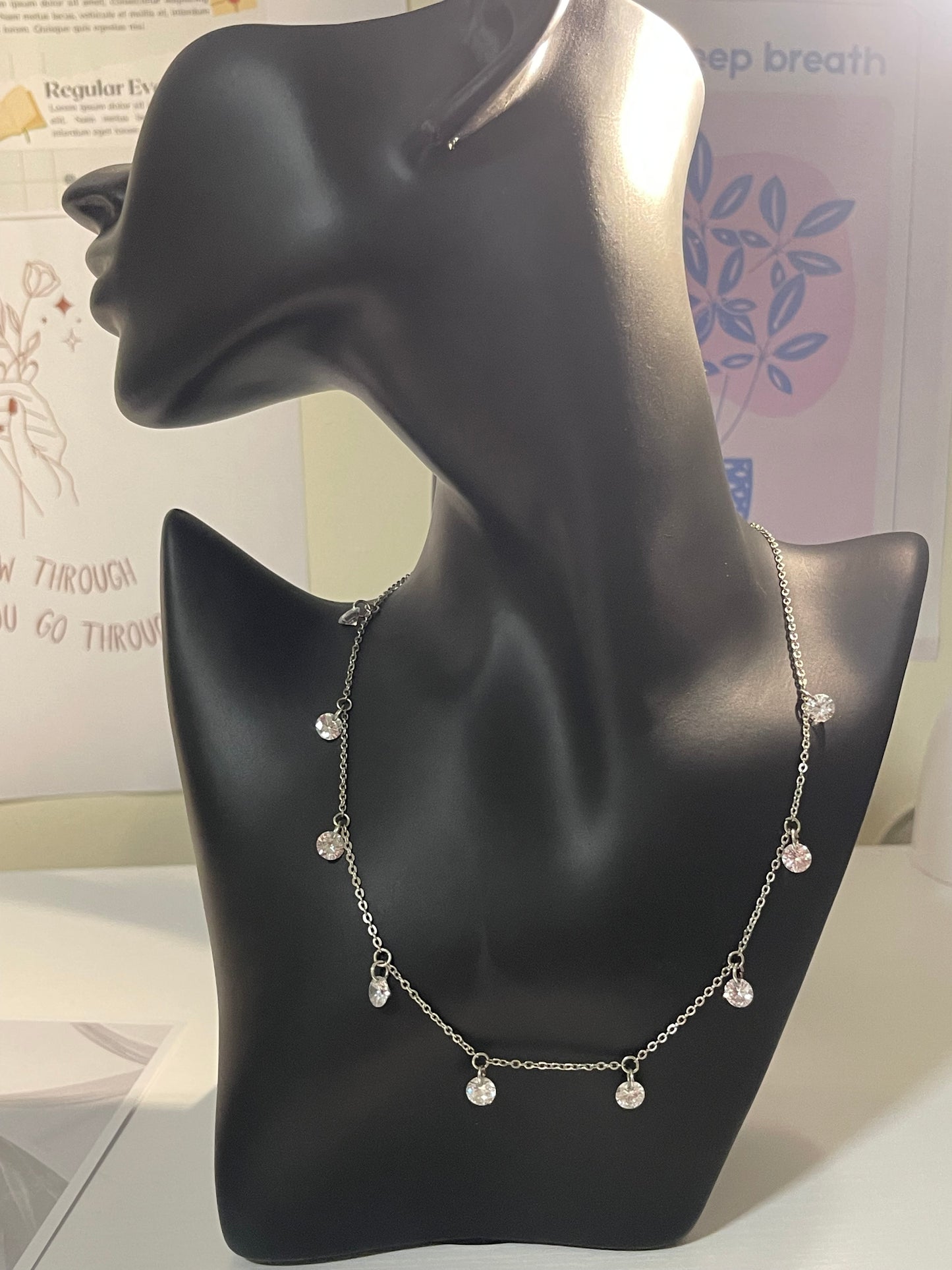 silver-toned station necklace with crystal or diamond-like droplets
