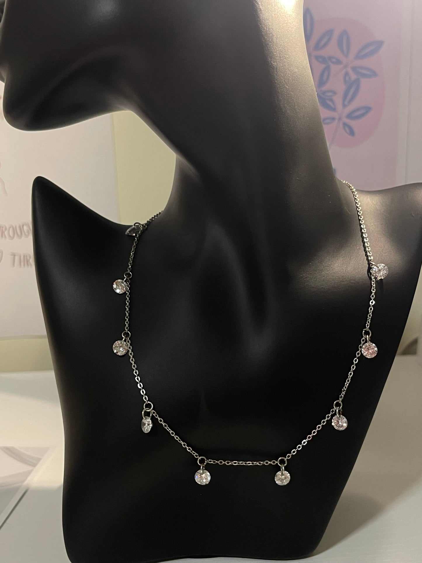 silver-toned station necklace with crystal or diamond-like droplets