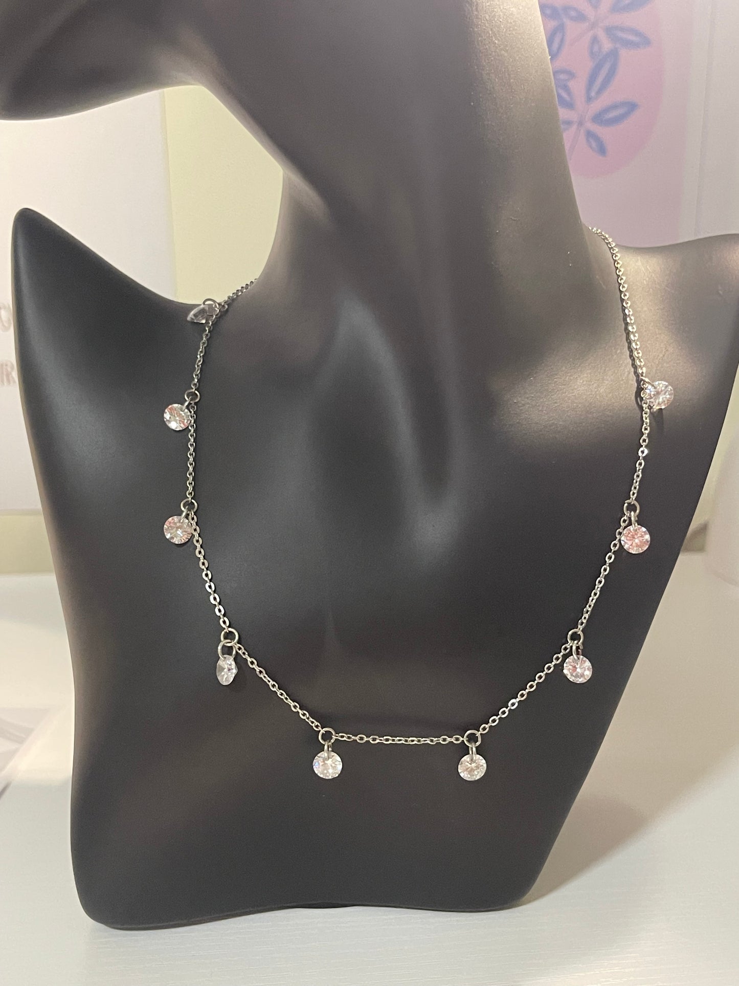 silver-toned station necklace with crystal or diamond-like droplets