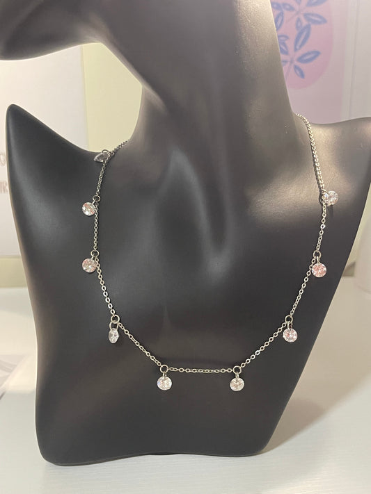 silver-toned station necklace with crystal or diamond-like droplets